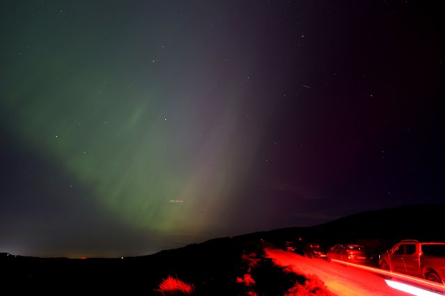 The aurora borealis, also known as the 'northern lights’, are seen over The Roaches near Leek, Staffordshire, Britain, on May 10, 2024. (Photo by Carl Recine/Reuters)