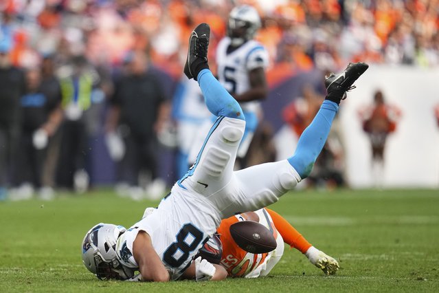 Denver Broncos safety Brandon Jones (22) tackles Carolina Panthers wide receiver Jalen Coker (18) during the second half of an NFL football game Sunday, October 27, 2024, in Denver. (Photo by Jack Dempsey/AP Photo)