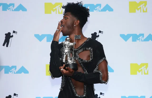 US rapper Lil Nas X poses with the award for Best Collaboration award for 'Industry Baby' in the press room during the MTV Video Music Awards at the Prudential Center in Newark, New Jersey on August 28, 2022. (Photo by Andres Kudacki/AFP Photo)