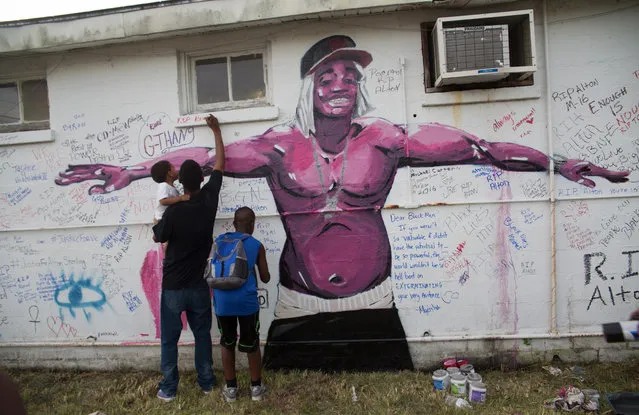Painting by Langston Allston, a New Orleans artist of one of the mourners he painted durring a vigil for Alton Sterling at the Triple S Food Mart, Wednesday, July 6, 2016. (Photo by Julie Dermansky)