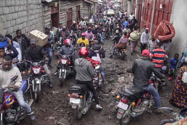 People rush to shop in downtown Goma, Congo Thursday, January 30, 2025, after the M23 rebels advanced into eastern Congo's capital Goma. (Photo by Brian Inganga/AP Photo)