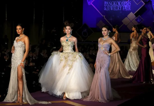 Models display jewerly at the 56th Bangkok Gems and Jewelry Fair at Muang Thong Tahni in Bangkok, Thailand, September 10, 2015. (Photo by Chaiwat Subprasom/Reuters)