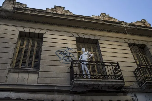 A mannequin is seen on balcony of an old building in Athens, Greece, June 24, 2015. (Photo by Marko Djurica/Reuters)
