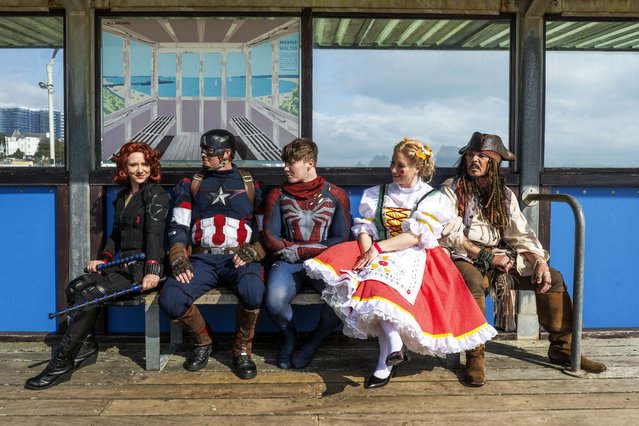Cosplayers on March 23, 2025 head to the beach during Bournemouth Comic Con in Dorset, UK, dressed as the film characters Black Widow, Captain America, Spider-Man, Doll on a Music Box from Chitty Chitty Bang Bang and Captain Jack Sparrow. (Photo by Zachary Culpin/Bournemouth News)