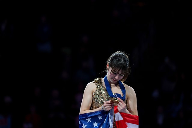 Alysa Liu looks at her gold medal on Friday, March 28, 2025 at TD Garden in Boston, MA after she became the first American woman in 19 years to win a figure skating world title. The 19-year-old retired from the sport three years ago and only returned to competition six months ago. (Photo by Maddie Meyer/Getty Images)