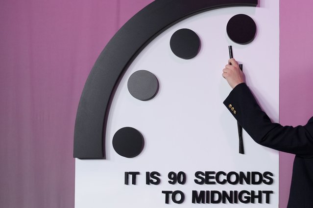 The Bulletin of the Atomic Scientists announces the latest decision on the “Doomsday Clock” minute hand, Tuesday, January 23, 2024, at the National Press Club Broadcast Center, in Washington. This year, Jan. 2024, the clock will remain set to 90 seconds to midnight. (Photo by Jacquelyn Martin/AP Photo)