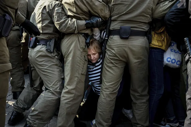 Police officers block and detain protesters during an opposition rally to protest the official presidential election results in Minsk, Belarus, Saturday, September 12, 2020. (Photo by Misha Friedman/AP Photo)