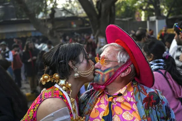 Two participants kiss each other as members of the LGBTQ community and their supporters march demanding equal marriage rights in New Delhi, India, Sunday, January 8 2023. The government is yet to legalize same-s*x marriages in the country even though the Supreme Court in 2018 struck down a colonial-era law that made gay s*x punishable by up to 10 years in prison. (Photo by AP Photo/Stringer)