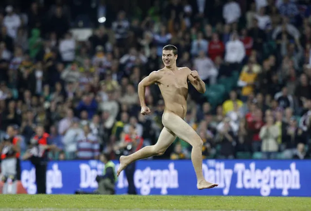 A streaker runs across the field during the centenary rugby league test match between Australia and New Zealand in Sydney, May 9, 2008. (Photo by Daniel Munoz/Reuters)