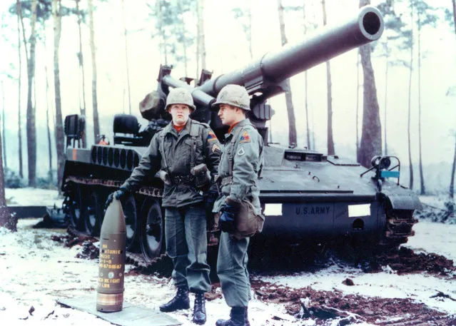 An 8-inch Howitzer Artillery Fired Atomic Projectile along side two U.S. Army soldiers with a tank in the background. (Photo by Los Alamos National Laboratory/US Army)