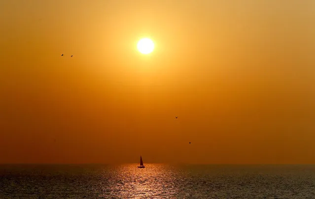 A yacht sails past St. Margaret's Bay at sunrise on September 20, 2020 near Dover in Kent, United Kingdom. (Photo by Gareth Fuller/PA Images via Getty Images)