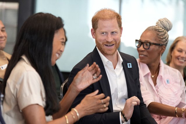 Britain's Prince Harry, Duke of Sussex (R) shares a light moment with ServiceNow's Chief Workforce Innovation Officer Karen Pavlin (L) and Diana Award CEO Tessy Ojo (2R), at event where he took part in a panel discussion on how social action positively impacts mental health, with four young people who are involved with The Diana Award, in central London on September 11, 2025. (Photo by Aaron Chown/AFP Photo)