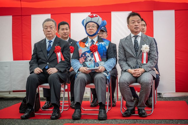 Hideki Tokoro (C), president of whaling company Kyodo Senpaku, and Shintaro Maeda (R), mayor of Shimonoseki city, attend a launch ceremony of Japan's new whaling mothership the Kangei Maru at a port in Shimonoseki city, Yamaguchi prefecture on May 21, 2024. The nearly 9,300-tonne ship set sail on its maiden hunting voyage on May 21, heralding a new era for the controversial practice defended by the government as an integral part of national culture. (Photo by Yuichi Yamazaki/AFP Photo)