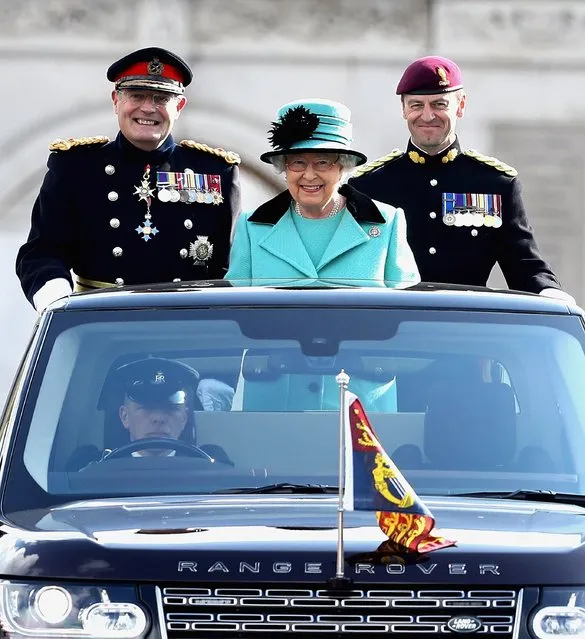Queen Elizabeth II reviews the parade alongside Lieutenant General Sir Mark Mans and Lieutenant Colonel Sean Cunniff (r) from the back of her customised Range Rover Vogue as she marks the Centenary of the Corps of the Royal Engineers at Brompton Barracks on October 13, 2016 in Chatham, England. (Photo by Chris Jackson/Getty Images)