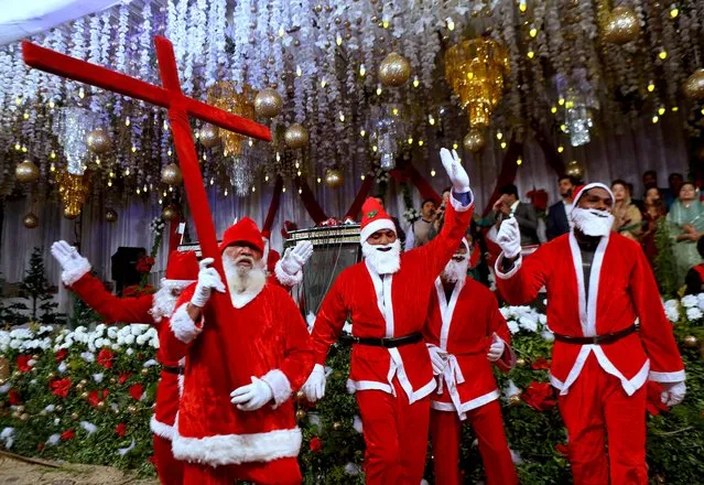 Pakistani Christians wear Santa Claus suits during a celebrations for Christmas, in Lahore, Pakistan, Wednesday, December 23, 2020. (Photo by K.M. Chaudary/AP Photo)