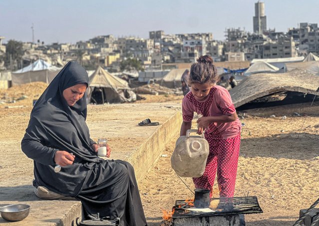 Alaa Shabat lives with her six children in a tent erected inside the Austrian cemetery in Khan Younis, southern Gaza Strip, on November 13, 2025, after her husband became ill and unable to work. (Photo by Tariq Mohammad/APAImages/Rex Features/Shutterstock)