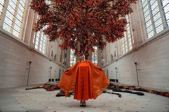 Joana Vasconcelos presents “Tree of Life (Arbre de Vie)”, a monumental installation depicting a giant red colored tree, at Sainte-Chapelle De Vincennes on April 25, 2023 in Paris, France. “Tree of life” is a 13-metre-high tree with 100,000 hand-woven and embroidered leaves with red, black and gold colors. It is part of the France-Portugal 2022 season and a tribute to Catherine de Medici. (Photo by Edward Berthelot/Getty Images)