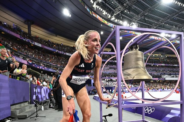 Britain's Keely Hodgkinson celebrates after winning the women's 800m final of the athletics event at the Paris 2024 Olympic Games at Stade de France in Saint-Denis, north of Paris, on August 5, 2024. (Photo by Ben Stansall/AFP Photo)