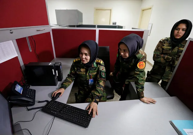 Second Lieutenant Roshan Gul, 22 (L), First Lieutenant Nelofar Frotan, 23 (C), and Second Lieutenant Morsal Afshar, 22 (R), work at the human resources office in the Ministry of Defence in Kabul, Afghanistan October 31, 2016. (Photo by Mohammad Ismail/Reuters)