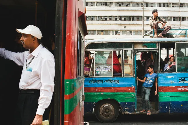 “Men on buses, Dhaka”. Passengers make their way through rush-hour traffic in one of Dhaka's public buses. Location: Dhaka, Bangladesh, Asia. (Photo and caption by Kristian Leven/National Geographic Traveler Photo Contest)