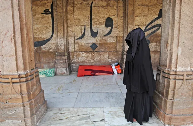 A Muslim woman prays inside Jama Masjid (Grand Mosque) during the holy fasting month of Ramadan in Ahmedabad, India, June 12, 2018. (Photo by Amit Dave/Reuters)