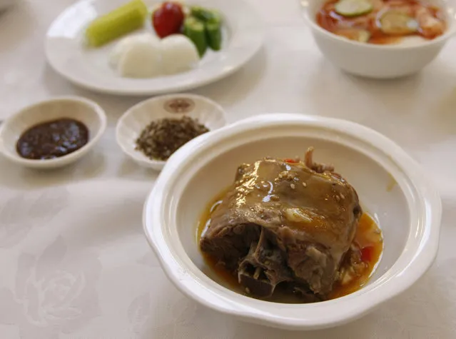 Dog meat or “Dan go gi” in North Korean expression, is placed on a table at a famous restaurant in Pyongyang November 13, 2008. (Photo by Lee Jae-Won/Reuters)