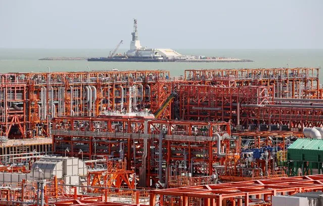 An oil rig (rear) and infrastructure of D Island, the main processing hub, are pictured at the Kashagan offshore oil field in the Caspian sea in western Kazakhstan August 21, 2013. (Photo by Reuters/Stringer)