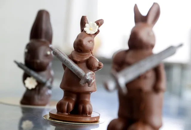 Chocolate Easter bunnies holding syringes are seen in the workshop of the Hungarian confectioner Laszlo Rimoczi, during the coronavirus disease (COVID-19) pandemic in Lajosmizse, Hungary, March 9, 2021. (Photo by Bernadett Szabo/Reuters)