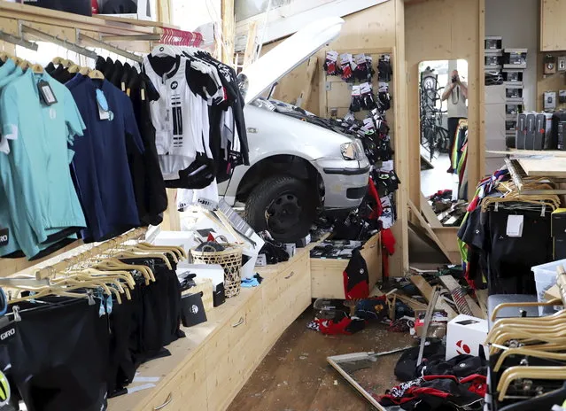 A car has crashed into a sports shop in Kempten, southern Germany, Tuesday, August 14, 2018. Nobody was injured. (Photo by Thomas Poeppel/DPA via AP Photo)