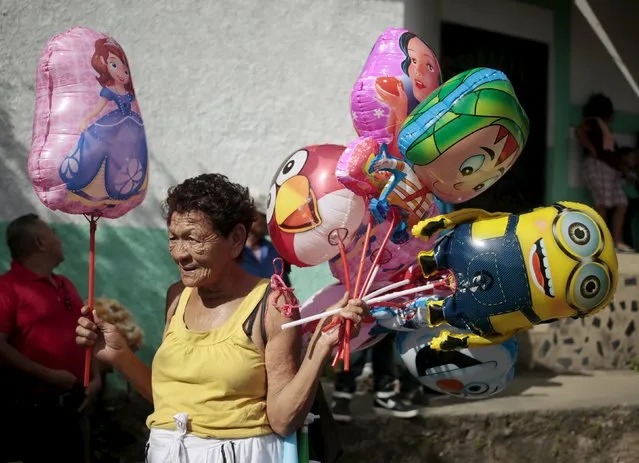 A woman sells balloons during a festival in honour of San Silvestre, in the town of Catarina, Nicaragua January 1, 2016. (Photo by Oswaldo Rivas/Reuters)