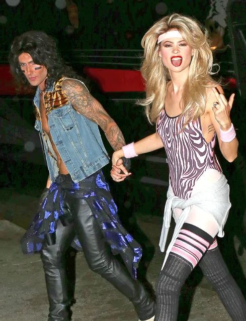 Singer and “The Voice” coach Adam Levine and his wife Behati Prinsloo going to a Halloween party in Sherman Oaks, California on October 31, 2014. Actress Melissa McCarthy said of Adam's Halloween party he hosted earlier in the week that “Every single woman had a bikini on of a different ilk”. (Photo by FameFlynet)