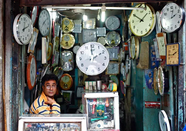 A shopkeeper waits for customers at his shop selling wall clocks in the old quarters of Delhi November 12, 2013. Data on Tuesday is forecast to show annual consumer inflation at 9.9 percent in October, up slightly from September, and figures on Friday are expected to show wholesale inflation running at an eight-month high of 6.90 percent, according to Reuters polls of economists. (Photo by Anindito Mukherjee/Reuters)