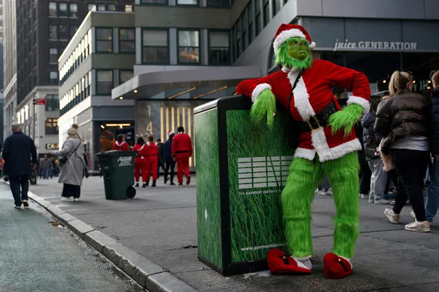 A reveller poses as he takes part in SantaCon in New York City, New York, U.S., December 9, 2023. (Photo by David Dee Delgado/Reuters)
