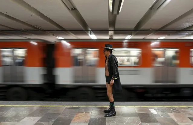 A passenger not wearing pants waits for a subway train during the “No Pants Subway Ride” in Mexico City, Mexico, February 21, 2016. (Photo by Carlos Jasso/Reuters)