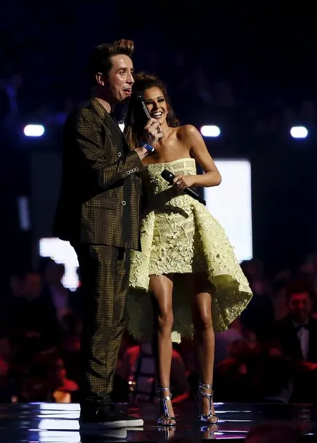 British singer Cheryl Fernandez-Versini (R) and radio presenter Nick Grimshaw present an award at the BRIT Awards at the O2 arena in London, Britain, February 24, 2016. (Photo by Stefan Wermuth/Reuters)