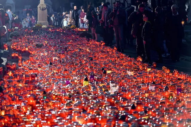 Thousands of lanterns lit by the local residents near the central cemetery at the Mirogoj cemetery on the All Saints' Day in Zagreb on November 1, 2022. (Photo by Denis Lovrovic/AFP Photo)