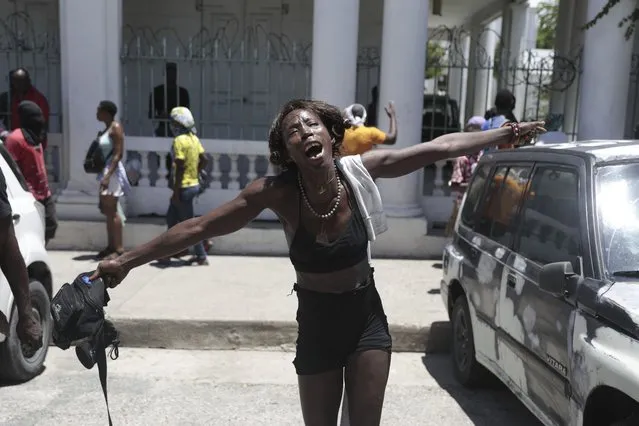 A woman shouts out how her family members died at the hands of gangs members in the Carrefour-Feuilles neighborhood, during a protest against insecurity in Port-au-Prince, Haiti, Friday, August 25, 2023. (Photo by Odelyn Joseph/AP Photo)