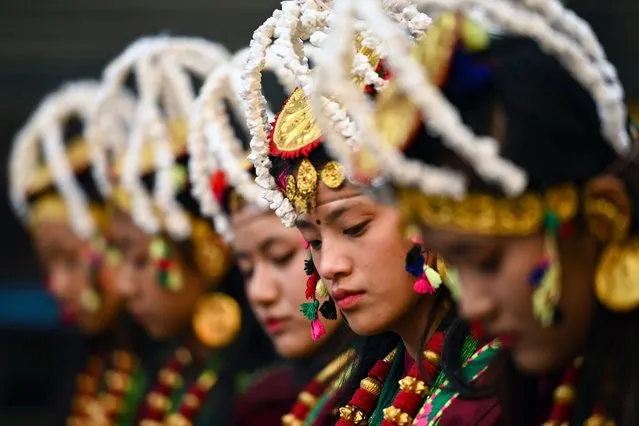 Members of the indigenous Gurung community wearing traditional attire dance on the occasion of “Tamu Lhosar” festival marking the commencement of Gurung new year in Kathmandu on December 31, 2023. (Photo by Prakash Mathema/AFP Photo)