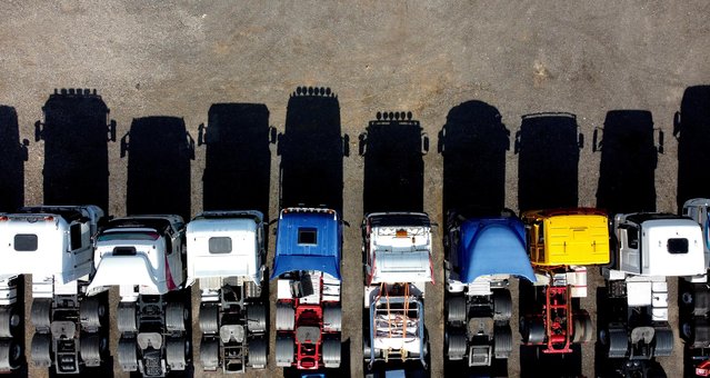 Lorries are parked up in a yard in Stoke-on-Trent, Staffordshire, Britain, September 20, 2021. Picture taken with a drone. (Photo by Carl Recine/Reuters)