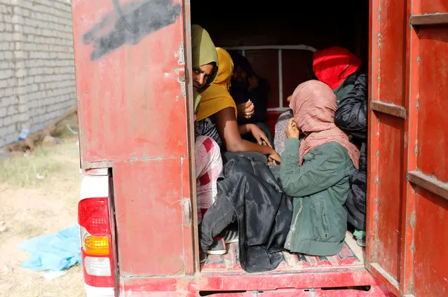 African migrants are transferred to a detention centre after being detained in Zawiya, northern Libya June 1, 2014. (Photo by Ahmed Jadallah/Reuters)