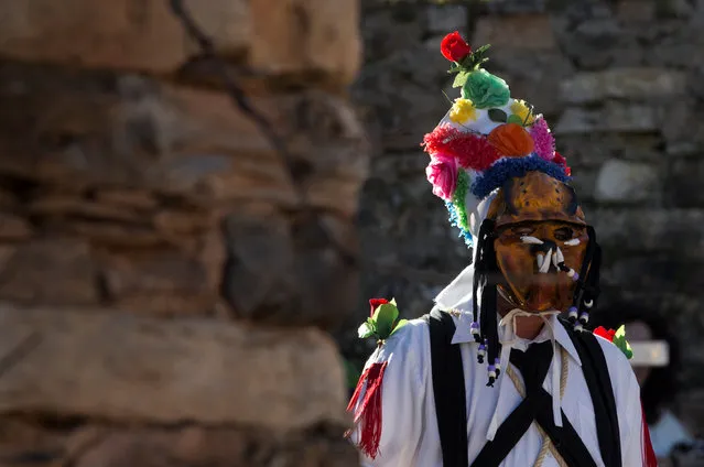 A reveller dressed as “Botargas” walks down a street during carnival celebrations in Almiruete, Spain, February 25, 2017. (Photo by Sergio Perez/Reuters)