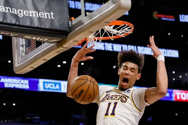 Los Angeles Lakers center-forward Jaxson Hayes scores during the second half of an NBA basketball game against the Minnesota Timberwolves, Sunday, April 7, 2024, in Los Angeles. (Photo by Etienne Laurent/AP Photo)