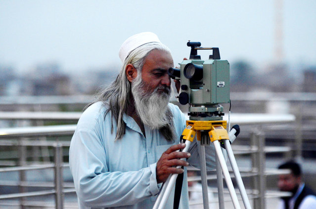 Peshawar Provincial Regional Office of the Ministry of Religion staff use a telescope to observe new moon sightings to determine Eid-al Fitr to mark the end of Ramadan in Peshawar, Pakistan, on 09 April 2024. Muslims around the world celebrate Eid al-Fitr, the three day festival marking the end of Ramadan on 09 April 2024. Eid al-Fitr is one of the two major holidays in the Islamic calendar. (Photo by Hussain Ali/ZUMA Press Wire/Rex Features/Shutterstock)