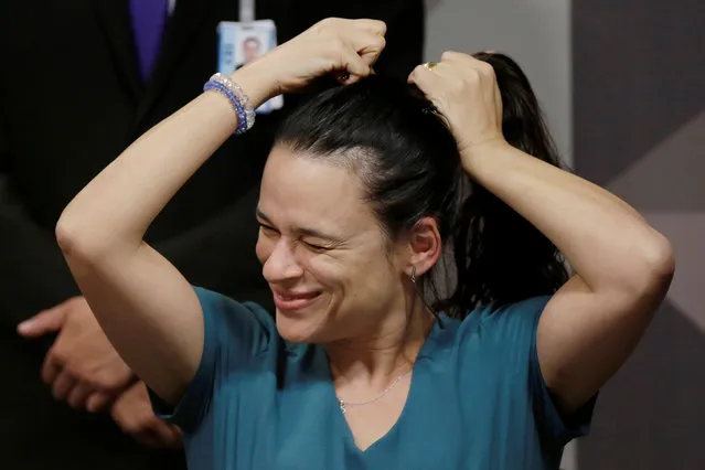 Brazilian jurist Janaina Paschoal, co-author of the complaint that originated the impeachment process against Brazil's President Dilma Rousseff, reacts during a meeting of the special senate committee that will consider Rousseff's impeachment, at the Federal Senate, in Brasilia, Brazil, April 28, 2016. (Photo by Ueslei Marcelino/Reuters)