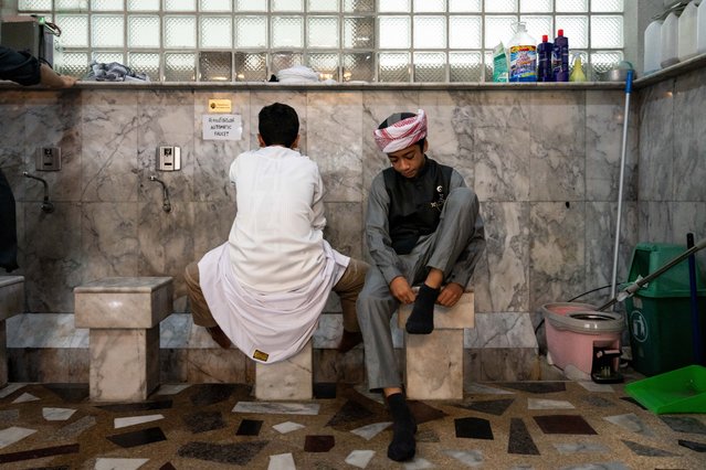 Young men wash their feet while Thai Muslims observe the beginning of Eid al-Fitr at Masjid Buddarul Mumineen mosque in Bangkok, Thailand on April 10, 2024. (Photo by Matt Hunt/Anadolu via Getty Images)