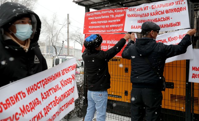People gather for a rally demanding the closure of Cactus Media, Kloop, Azattyk in Bishkek, Kyrgyzstan, 09 February 2022. Those present demanded that Kaktus-media, Kloop and Azattyk be declared foreign agents. They called these editorial offices destabilizing the life of the Kyrgyz people and called for the shut down of the publications because journalists gave information - a reprint from the Tajik site Asia Plus – about the conflict on the Kyrgyz-Tajik border. The Prosecutor General's Office disseminated information that a criminal case had been opened on the fact of the publication of an armed conflict in the border zone. (Photo by Igor Kovalenko/EPA/EFE)