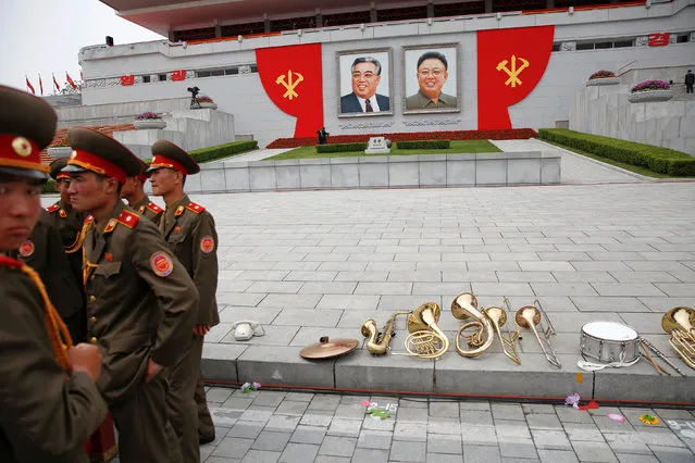 Members of a military band stand by their instruments at the capital's main ceremonial square after a mass rally and parade, a day after the ruling party wrapped up its first congress in 36 years by elevating him to party chairman, in Pyongyang, North Korea, May 10, 2016. (Photo by Damir Sagolj/Reuters)