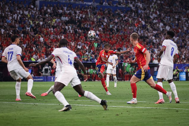 Lamine Yamal of Spain scores his side's first goal during the UEFA EURO 2024 semi-final match between Spain v France at Munich Football Arena on July 09, 2024 in Munich, Germany. (Photo by James Gill – Danehouse/Getty Images)