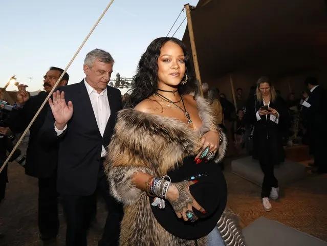 Singer Rihanna (R) and Christian Dior Couture president and CEO Sidney Toledano attends the Christian Dior Cruise 2018 Runway Show at the Upper Las Virgenes Canyon Open Space Preserve on May 11, 2017 in Santa Monica, California. (Photo by Mario Anzuoni/Reuters)