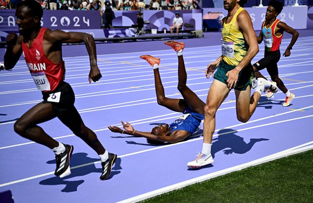 Abdihamid Nur of United States falls in the athletics men's 5,000m round 1 competition during the Paris 2034 Olympics in Saint-Denis, France on August 7, 2024. (Photo by Dylan Martinez/Reuters)